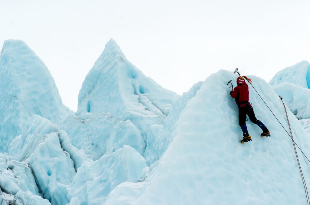Emotional Intelligence PDF Summary - Man conquering a snow peak
