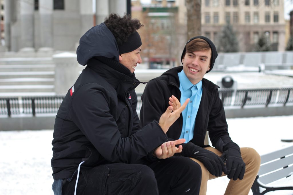 2 friends enjoying a conversation