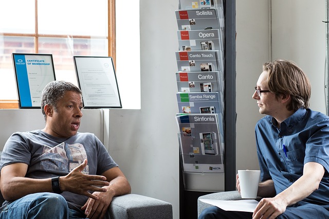 man listening intently to someone talking