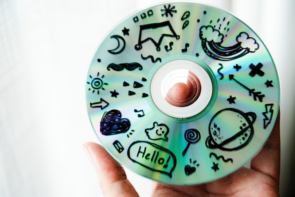 a compact disc with life doodles